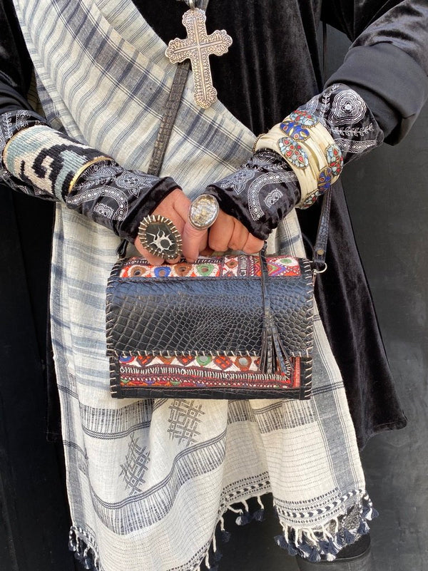 Lunchbox luxe at Serrahna: this original one of a kind croc embossed leather mini satchel trimmed with Jat hand embroidery. It's big enough to hold a cell phone, keys, glasses, wallet, lipgloss and more.