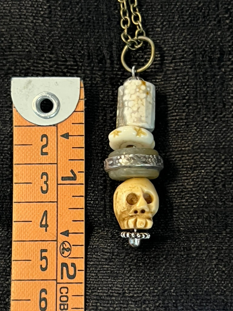 TINY SKULL PENDANT