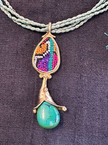 TEXTILES AND TURQUOISE PENDANT