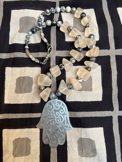 Silver large hamsa necklace peach Moroccan resin beads black & white ceramic marble beads long statement necklace Andrea Serrahn Serrahna