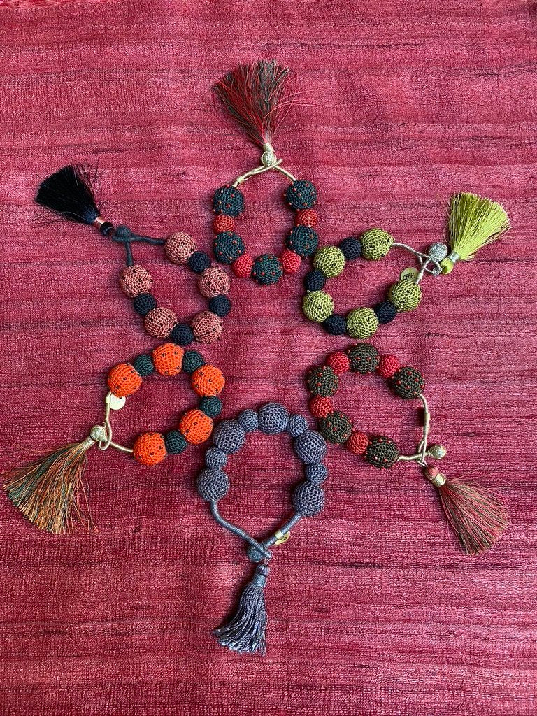 Hand crocheted ball tassel bracelets Andrea Serrahn Serrahna